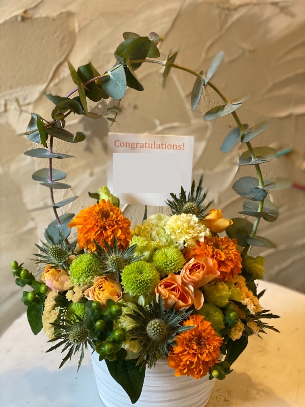 「太陽みたいに明るく笑顔溢れる素敵なお店であり続けてほしい」気持ちの明るくなる開店祝い花